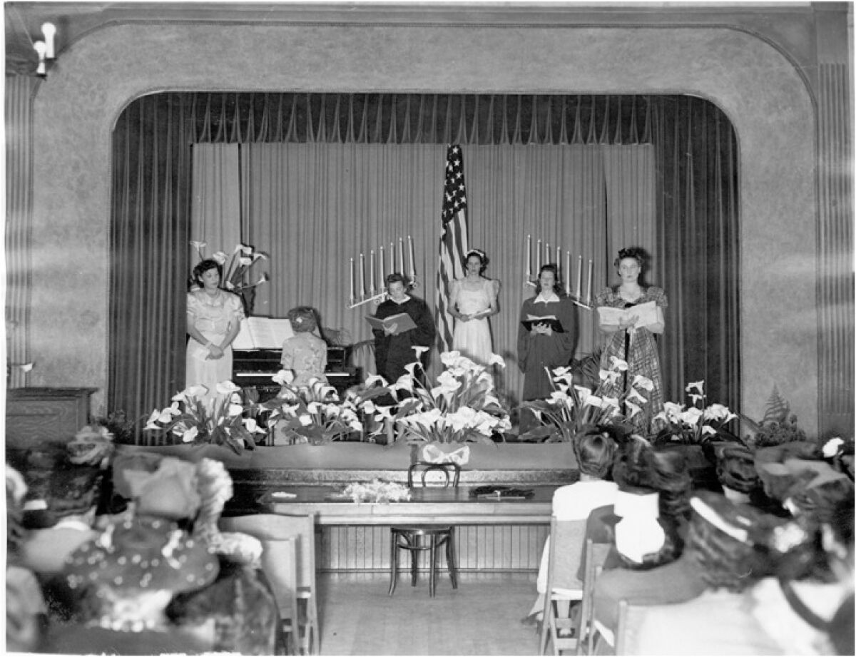 The stage at the Pacific Beach Woman's Club meeting hall being used for an installation of officers in the 1950s. 
