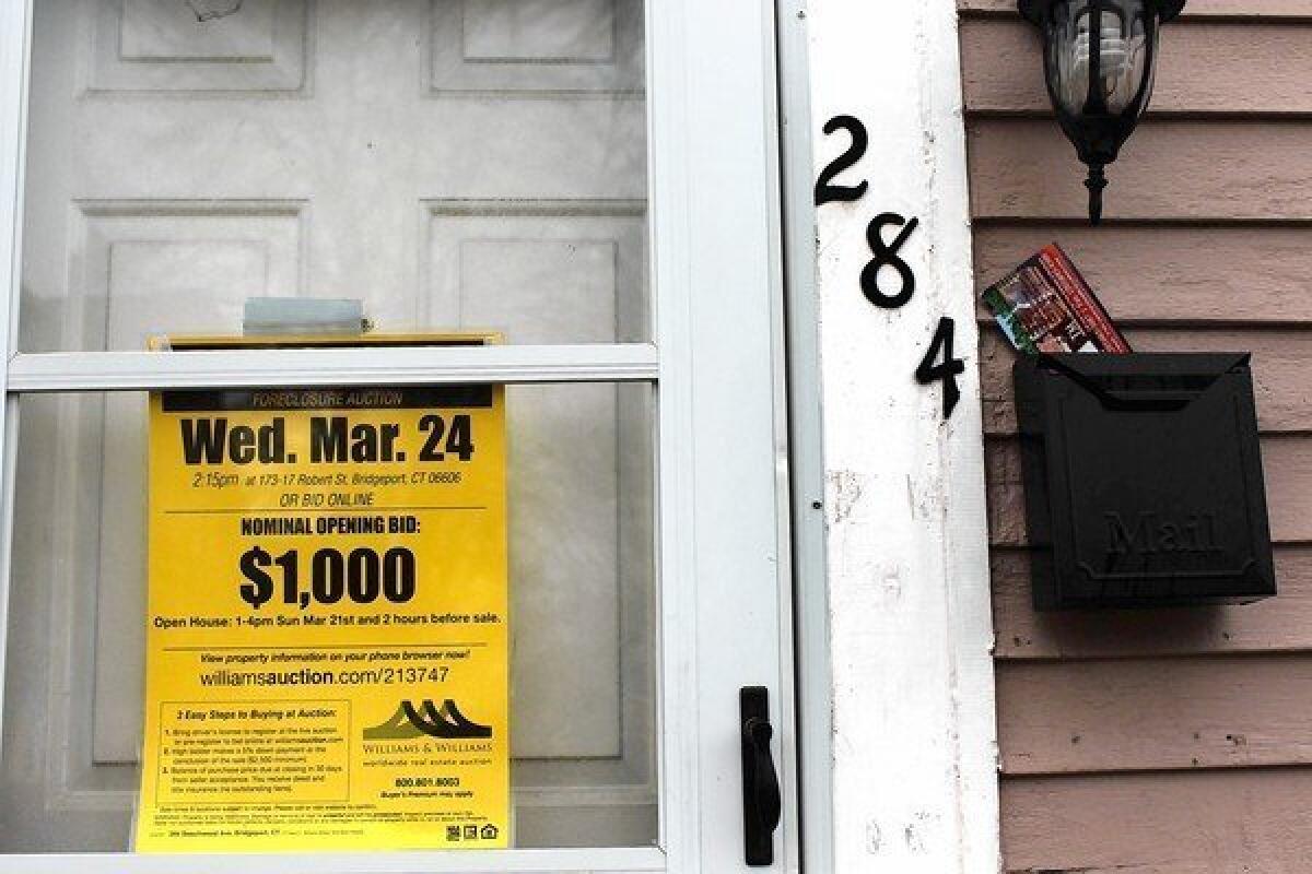 Going after strategic defaulters is big money. According to a report by the inspector general's office criticizing Freddie Mac's lax practices, the company has left billions on the table. Above, a foreclosed home is advertised for bidding in Bridgeport, Conn.