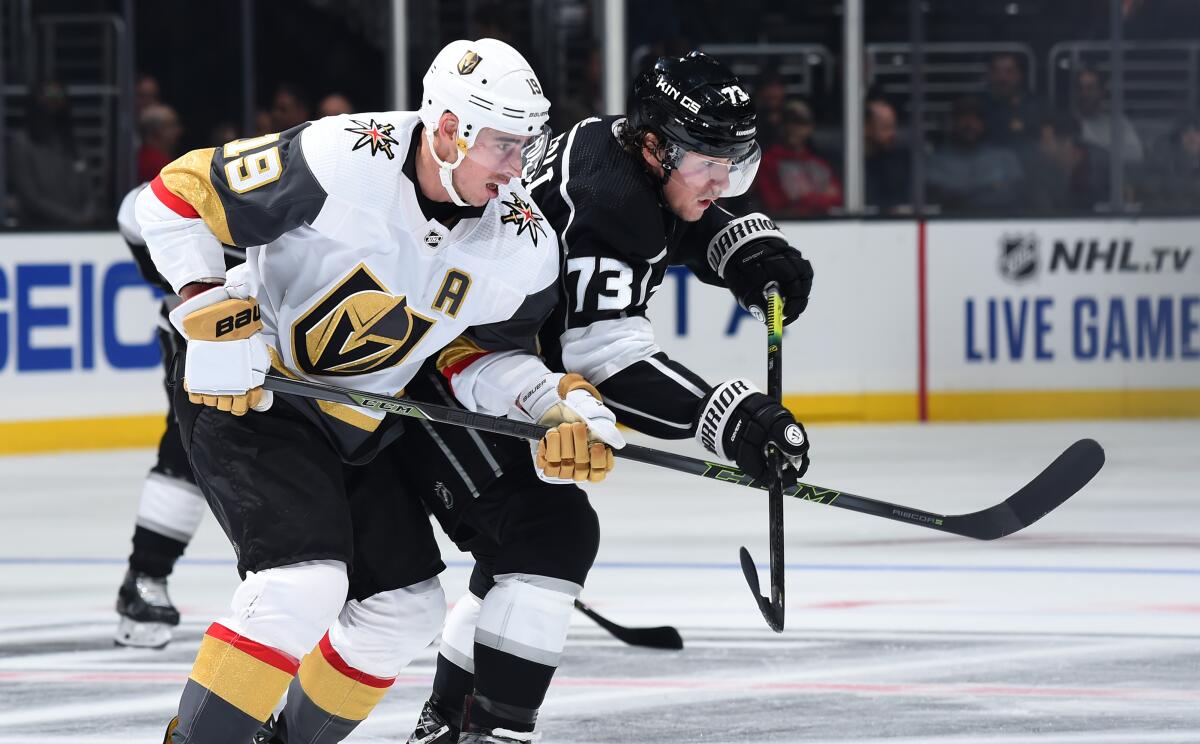 Vegas forward Reilly Smith and Kings forward Tyler Toffoli battle for position during the third period of the Kings' 5-2 loss at Staples Center on Sunday.