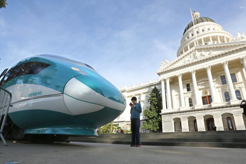 More than a dozen lawsuits have been filed against the state's bullet train project. Above, a full-scale mock-up of a high-speed train is displayed at the Capitol in Sacramento in October.
