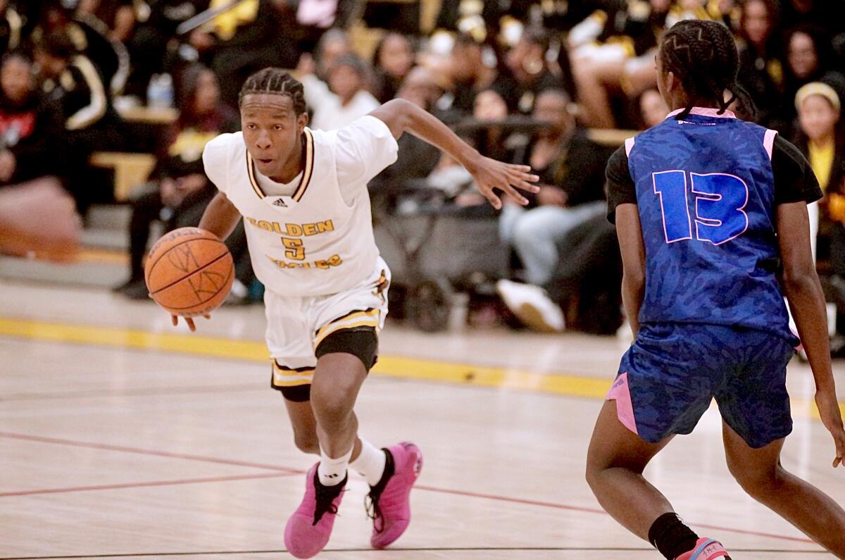 Kings/Drew guard Jayshawn Kibble drives to the basket during a City Section Open Division playoff victory over Palisades.