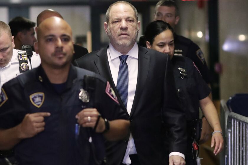 Harvey Weinstein, center, enters State Supreme Court in New York on Oct. 11, 2018. A year earlier, Weinstein was a catalyst in launching the #MeToo movement, which took off in October 2017 after reports in The New Yorker and The New York Times detailed multiple allegations of sexual misconduct against him. (AP Photo/Mark Lennihan)