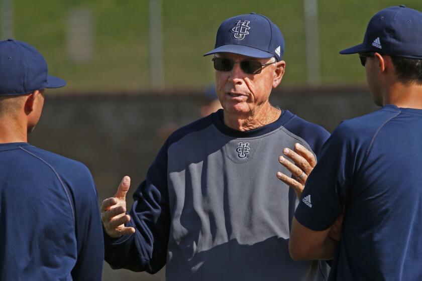 IRVINE, CA. - JUNE 10, 2014: Head coach Mike Gillespie, center, talks with coach Ben Orloff (CQ), left, and director of operations Eric Deragisch (CQ), right, during practice of the UC Irvine baseball team at Anteater Ballpark in Irvine on June 10, 2014. (Anne Cusack/Los Angeles Times)