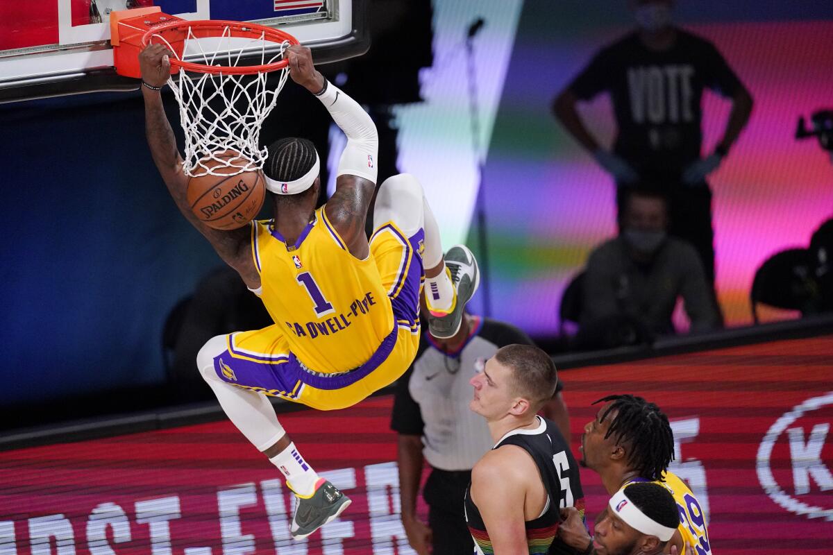 Lakers guard Kentavious Caldwell-Pope throws down a dunk late in Game 4.