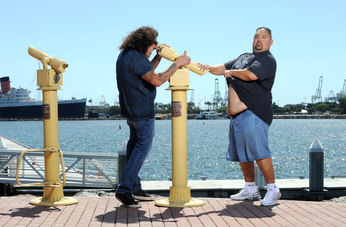 Comedians Gabriel Iglesias, right, and Martin Moreno have fun outside of Parkers' Lighthouse in Long Beach.
