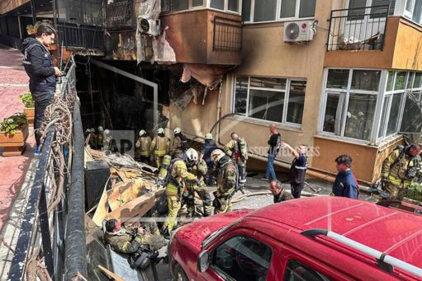 Firefighters work after a fire broke out at a nightclub in Istanbul, Turkey, Tuesday, April 2, 2024. A fire at an Istanbul nightclub during renovations on Tuesday killed at least 27 people, officials and reports said. Several people, including managers of the club, were detained for questioning. (IHA via AP)