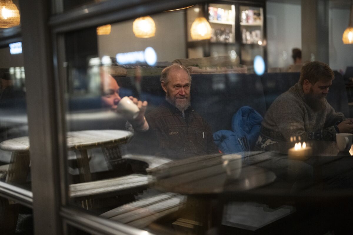 Retired miners gather together at a coffee shop.