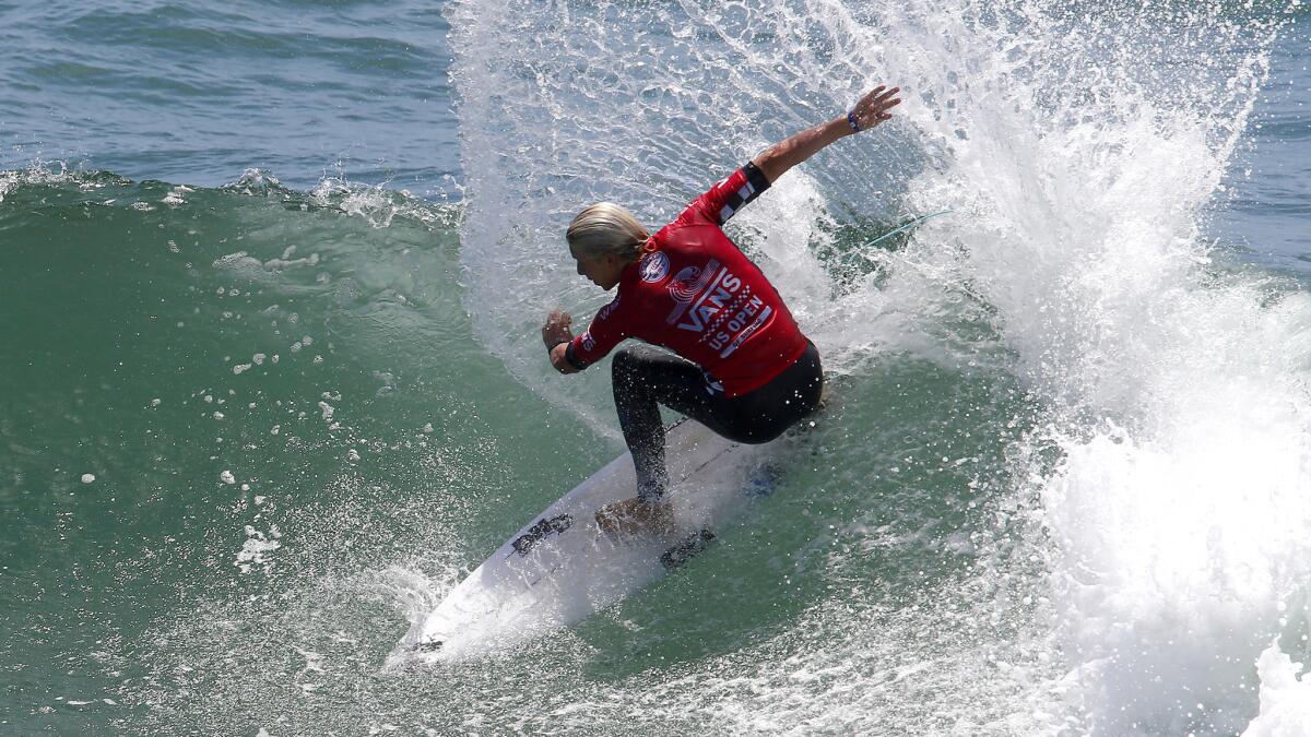 Australian Ethan Ewing, shown during a heat Wednesday, has advanced to the fifth round of the U.S. Open of Surfing.