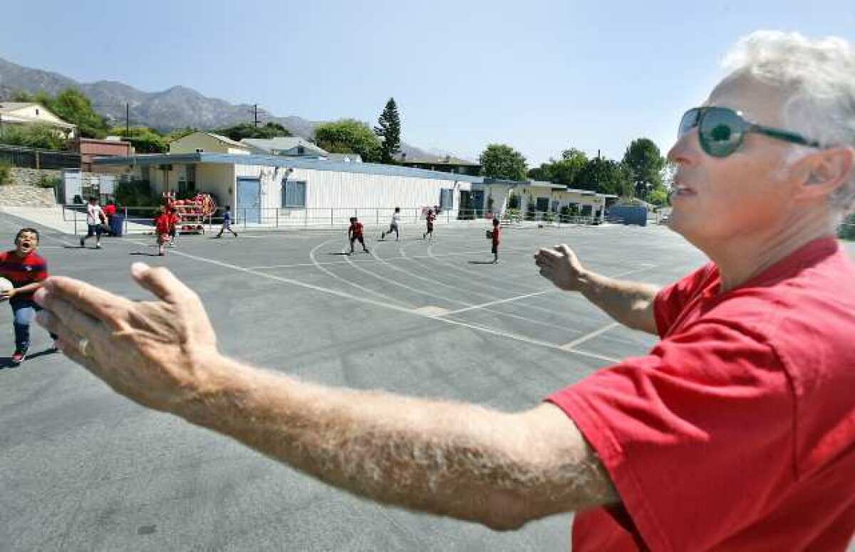 Principal Stephen Williams spans his arms to show all of the bungalow classrooms that will be replaced at Lincoln Elementary School in La Crescenta where a portion of $270-million in Measure S funds will be spent.