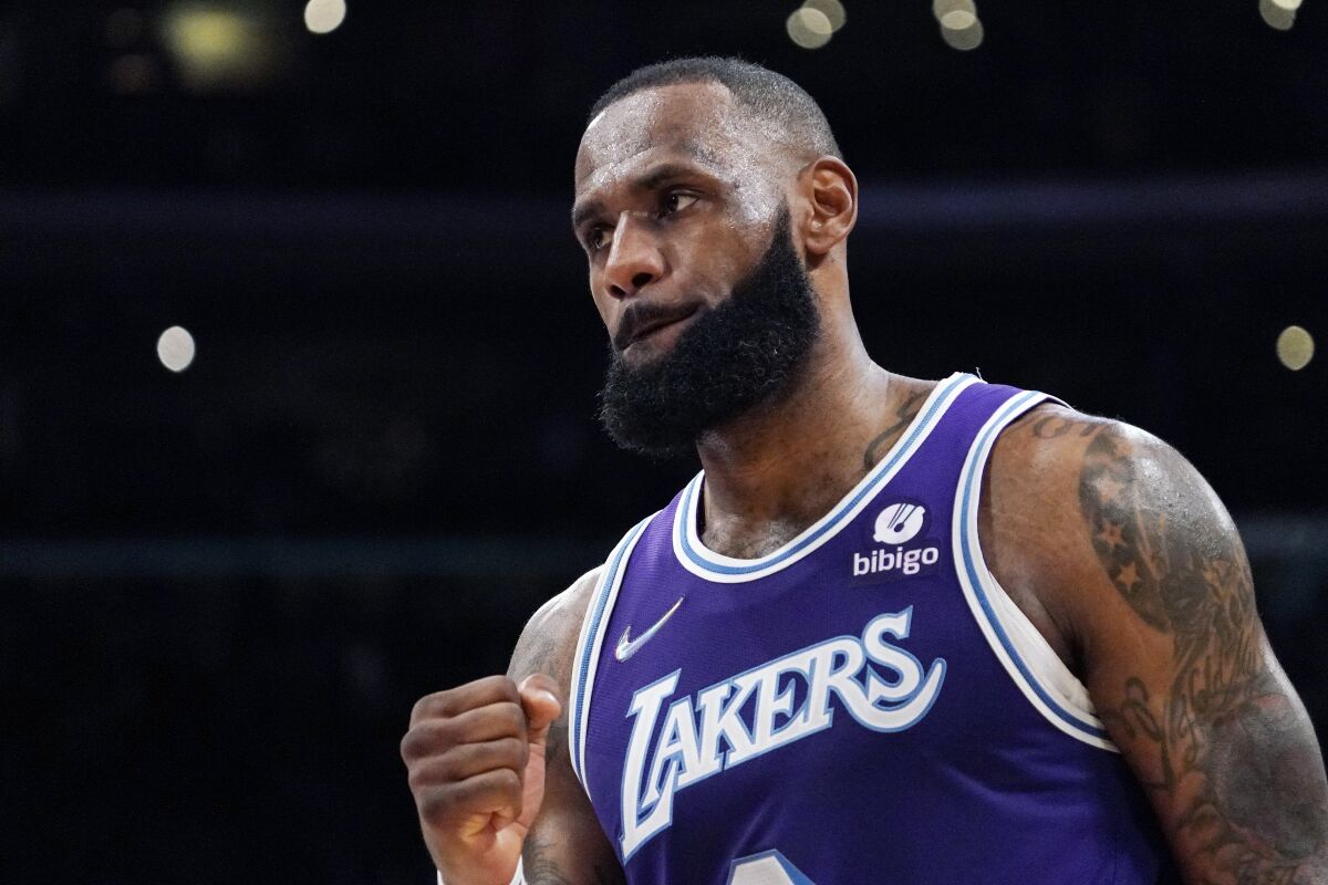 Los Angeles Lakers forward LeBron James celebrates as the Lakers defeat the New York Knicks 122-115 in overtime of an NBA basketball game Saturday, Feb. 5, 2022, in Los Angeles. (AP Photo/Mark J. Terrill)