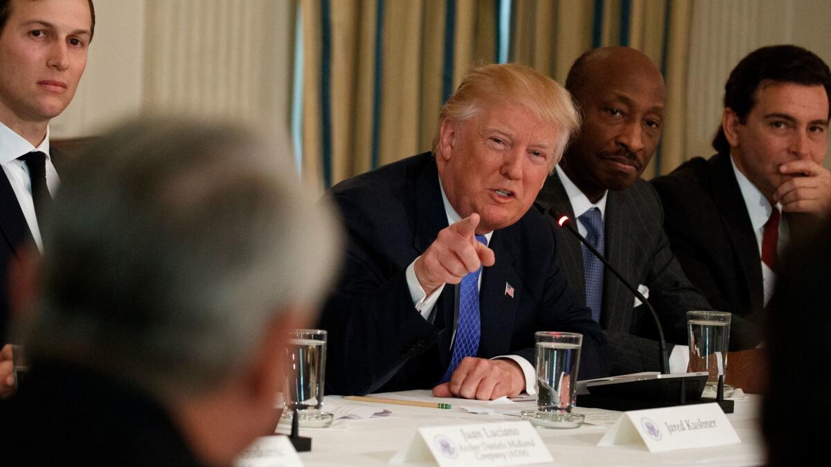 President Trump meets with manufacturing executives at the White House. From left are White House Senior Advisor Jared Kushner, Trump, Merck CEO Kenneth Frazier and Ford CEO Mark Fields.