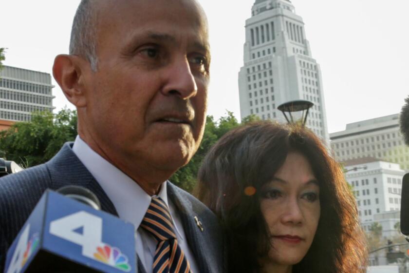 Former L.A. County Sheriff Lee Baca and his wife, Carol Chiang, arrive at federal court earlier this week in Baca's obstruction of justice trial.