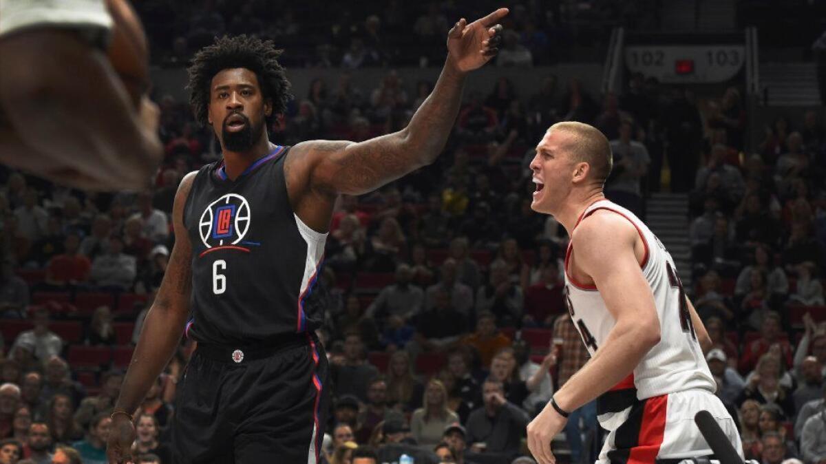 Clippers center DeAndre Jordan, left, reacting with Mason Plumlee of the Portland Trail Blazers to a foul call, makes getting offensive rebounds a priority.