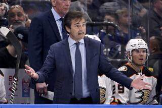 Anaheim Ducks coach Dallas Eakins react to a call during the third period of the team's NHL hockey game.