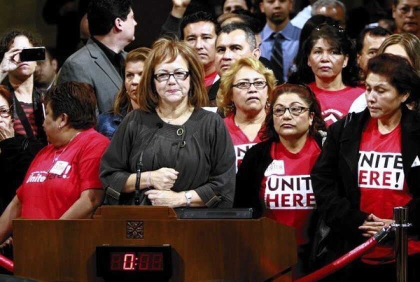 Maria Elena Durazo, center, of the county Federation of Labor, says labor leaders hope a coming Los Angeles proposal to require large hotels to pay workers at least $15 an hour will spread to other industries.