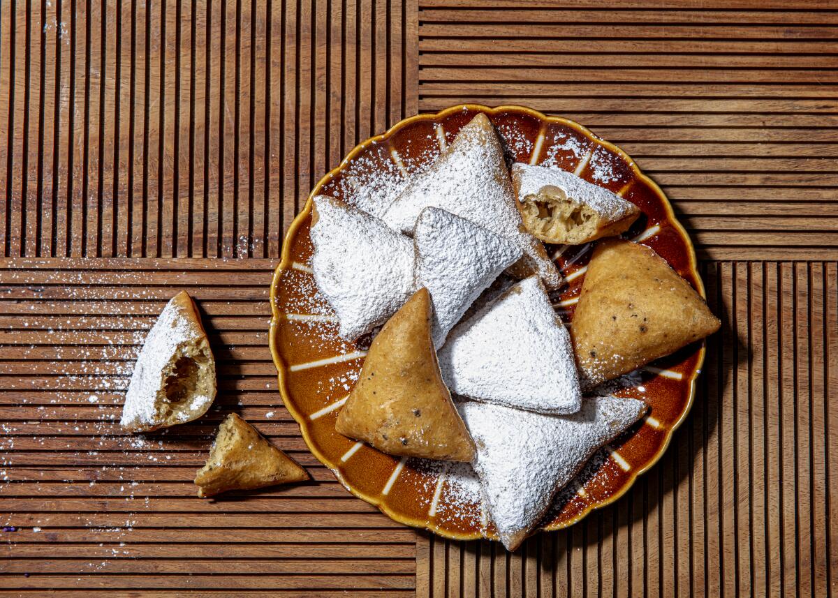 A plate of sugar-dusted mandazi 