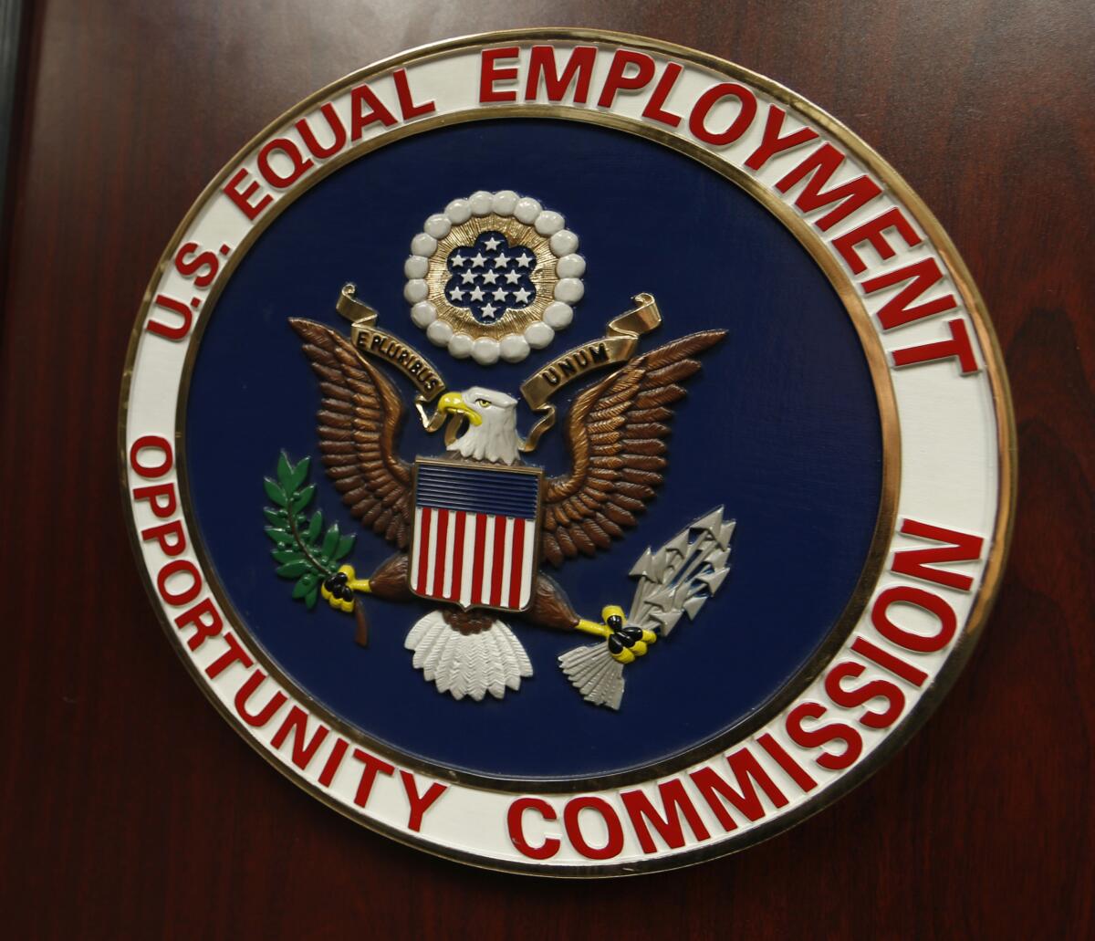 The emblem of the U.S. Equal Employment Opportunity Commission is shown on a podium 