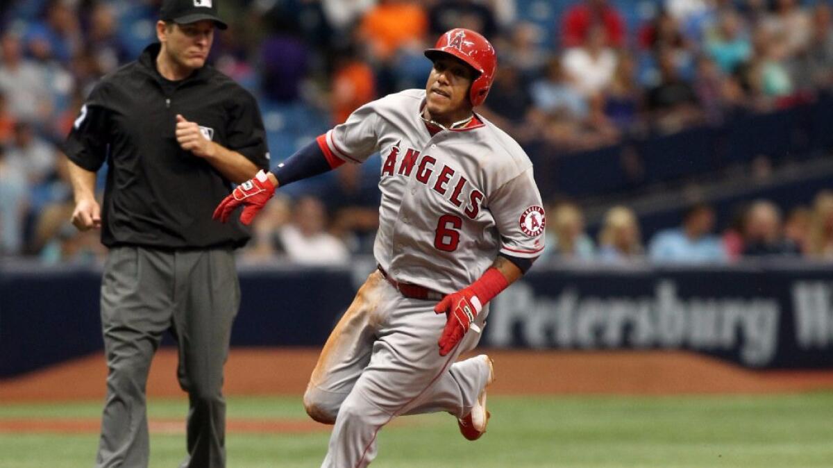 Angels infielder Yunel Escobar rounds third base on his way to score off an RBI single by Albert Pujols during a game on July 7.