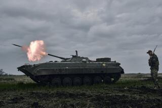 FILE - A Ukrainian APC fires towards Russian positions near Avdiivka, in the Donetsk region, Ukraine, Friday, April 28, 2023. A dayslong attempt by Russian forces to storm a strategically important city in eastern Ukraine appears to be running out of steam, Kyiv officials claimed Monday, Oct. 16, 2023 as the Kremlin’s war entered its 600th day. (AP Photo/Libkos, File)