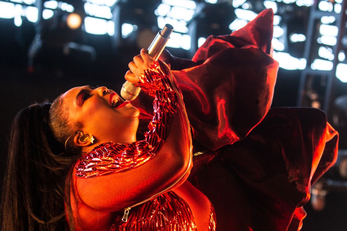 Lizzo is shown performing in April at the 2019 Coachella Valley Music and Arts Festival in Indio. While suffering from a cold at her October concert in San Diego, the singer, rapper and flutist kept the sold-out audience on its feet throughout.