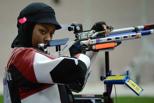 Qatari Bahya Mansour al-Hamad competes in the women's 10-meter air rifle qualification at the Royal Artillery Barracks in London.
