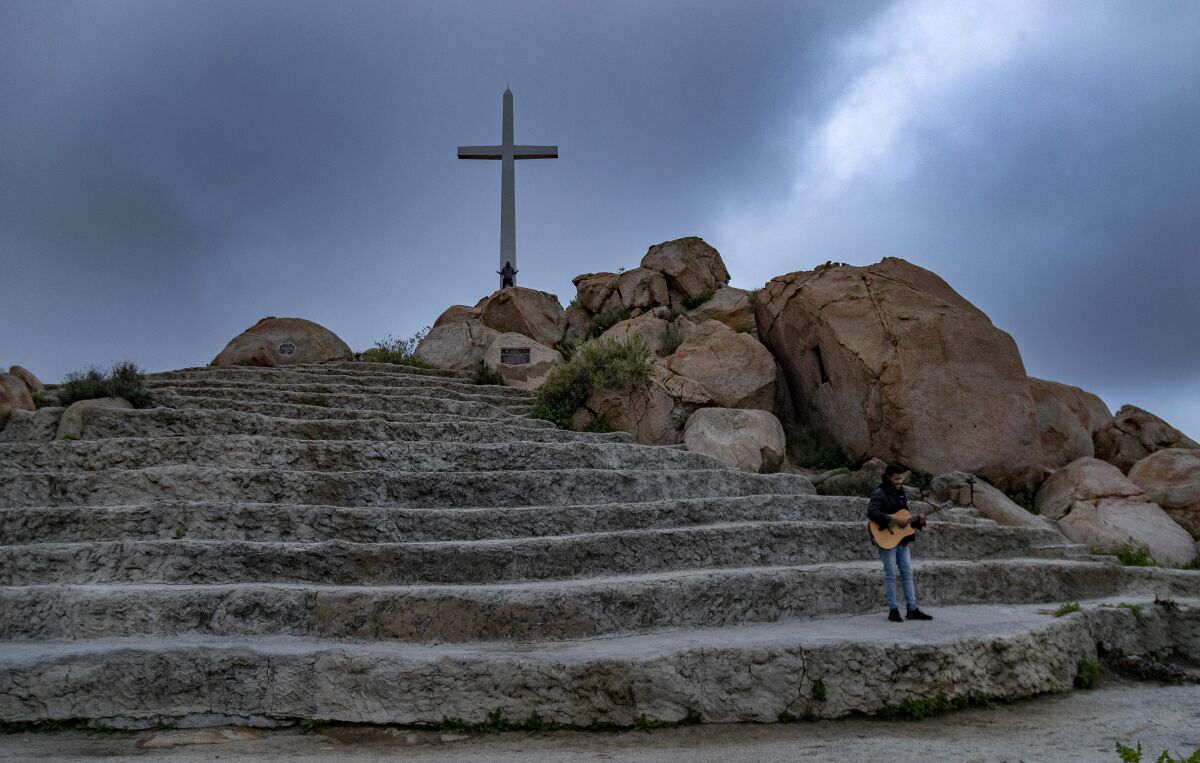 In Riverside, guitarist Javon Jones of Antioch Church sings gospel hymns during a live-streamed sunrise Easter service on Mt. Rubidoux. The coronavirus pandemic forced the cancellation of services on Mt. Rubidoux for just the third time in 111 years. 