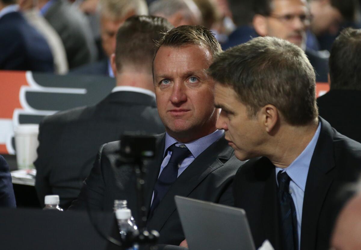 Kings general manager Rob Blake, left, sits next to Kings president Luc Robitaille.