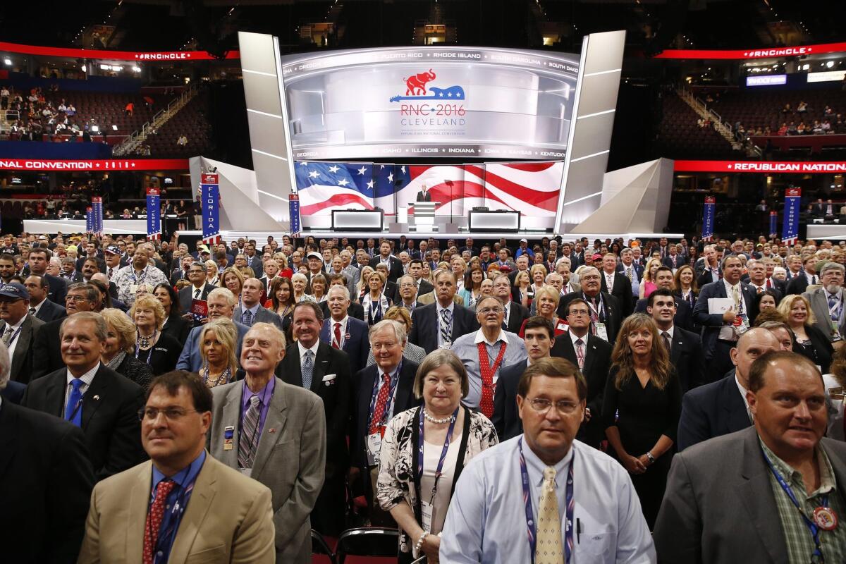 Delegates pose for the official convention photograph during the first day of the 2016 Republican National Convention in Cleveland. The convention's opening moments included a performance of the Turtles' "Happy Together" -- much to the band's dismay.