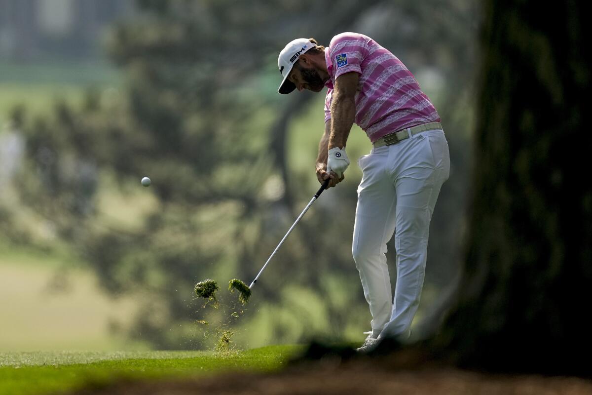 Dustin Johnson hits on the first fairway during the first round of the Masters.