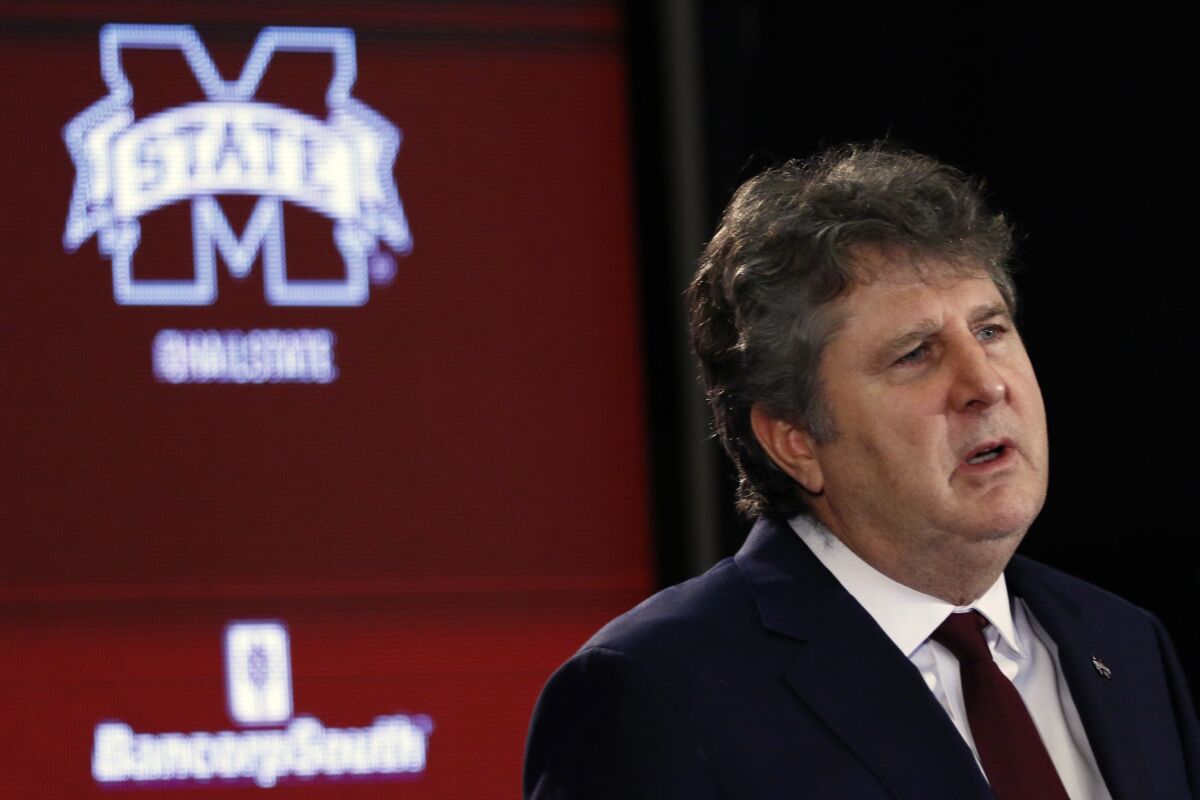 Mississippi State coach Mike Leach speaks at a news conference 