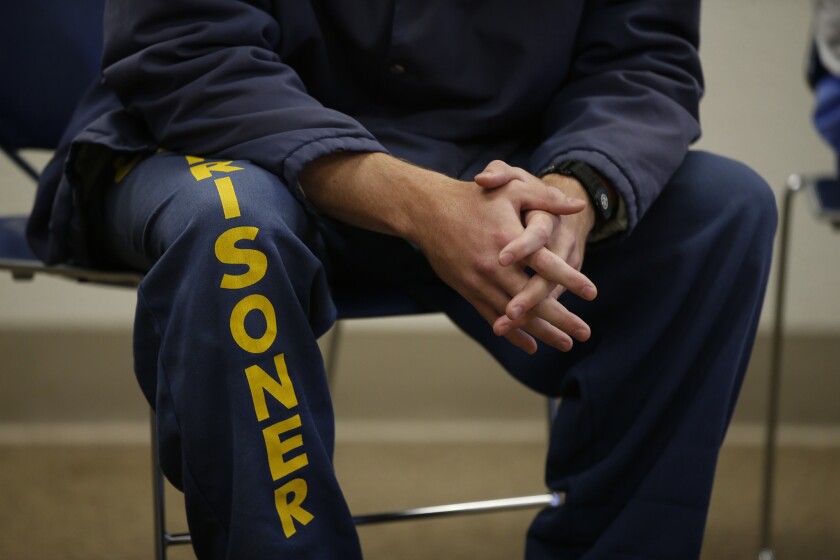 An inmate at Solano State Prison wears prison garb.