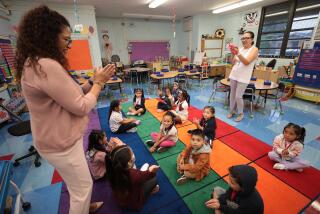 Los Angeles, CA - August 14: Lenicia B. Weemes Elementary School on Monday, Aug. 14, 2023 in Los Angeles, CA. First day of school TK (transitional kindergarten) students clap to songs with teacher Matilde Lopez, right, and coach Claude Mesa, left, on the first day of school at Lenicia B. Weemes Elementary School on the first day of classes for LAUSD students. (Al Seib / For The Times)
