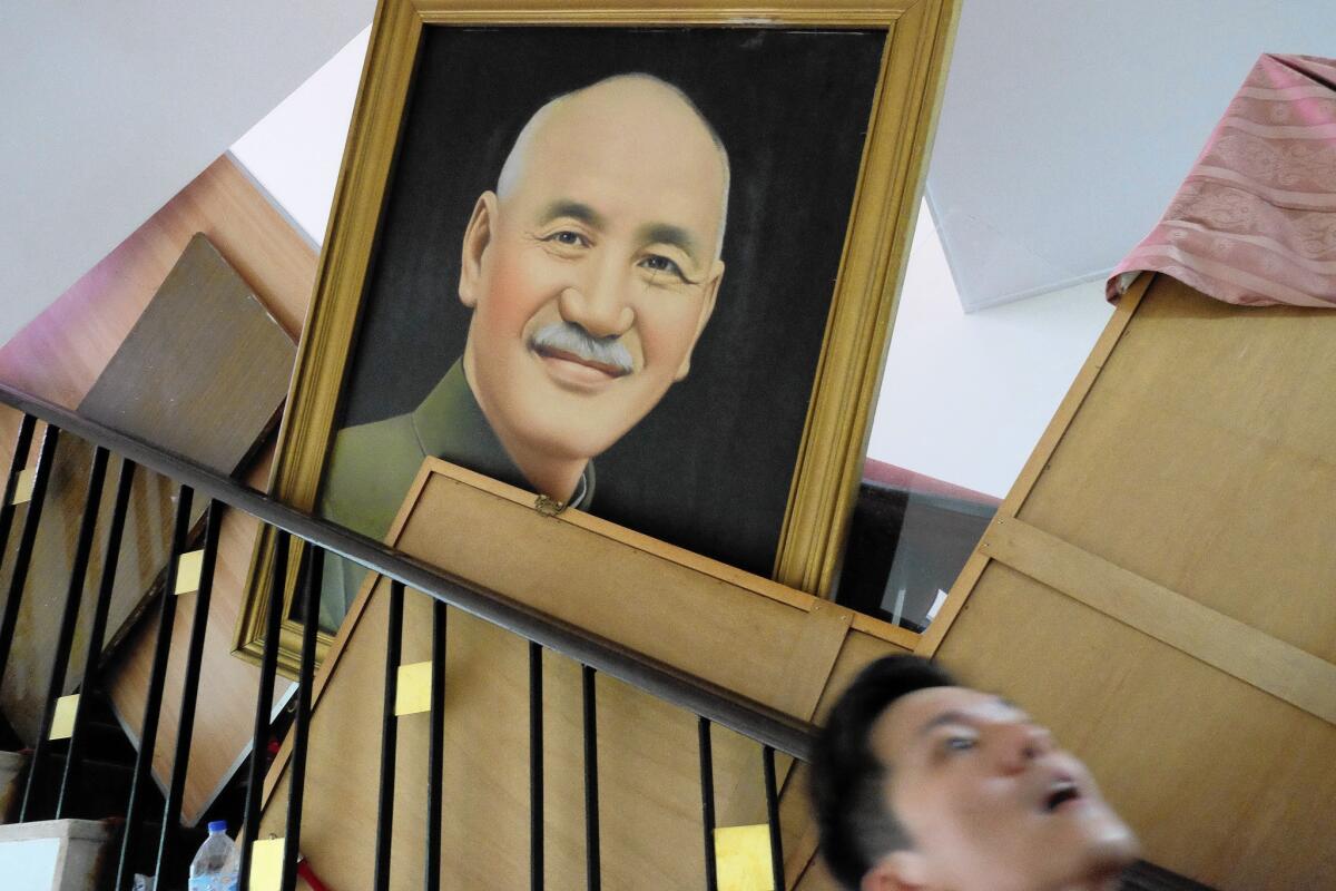 A portrait of former Taiwanese President Chiang Kai-shek is seen during a protest at the parliament building in Taipei in March.