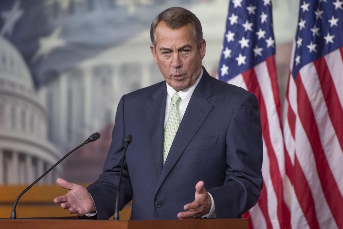House Speaker John Boehner takes a question during a news conference.