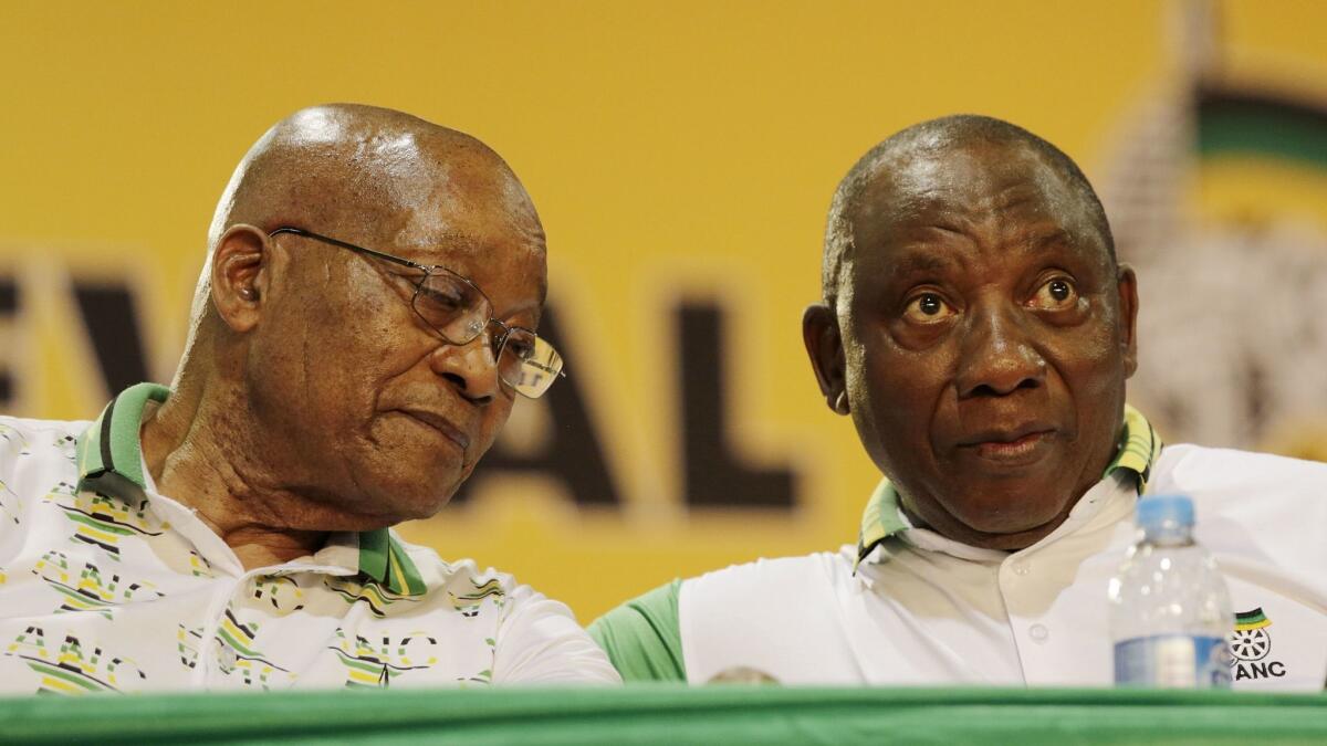 ANC Deputy President Cyril Ramaphosa, right, and outgoing President Jacob Zuma are shown during the 54th ANC National Conference in Johannesburg , South Africa, on Dec. 18, 2017.