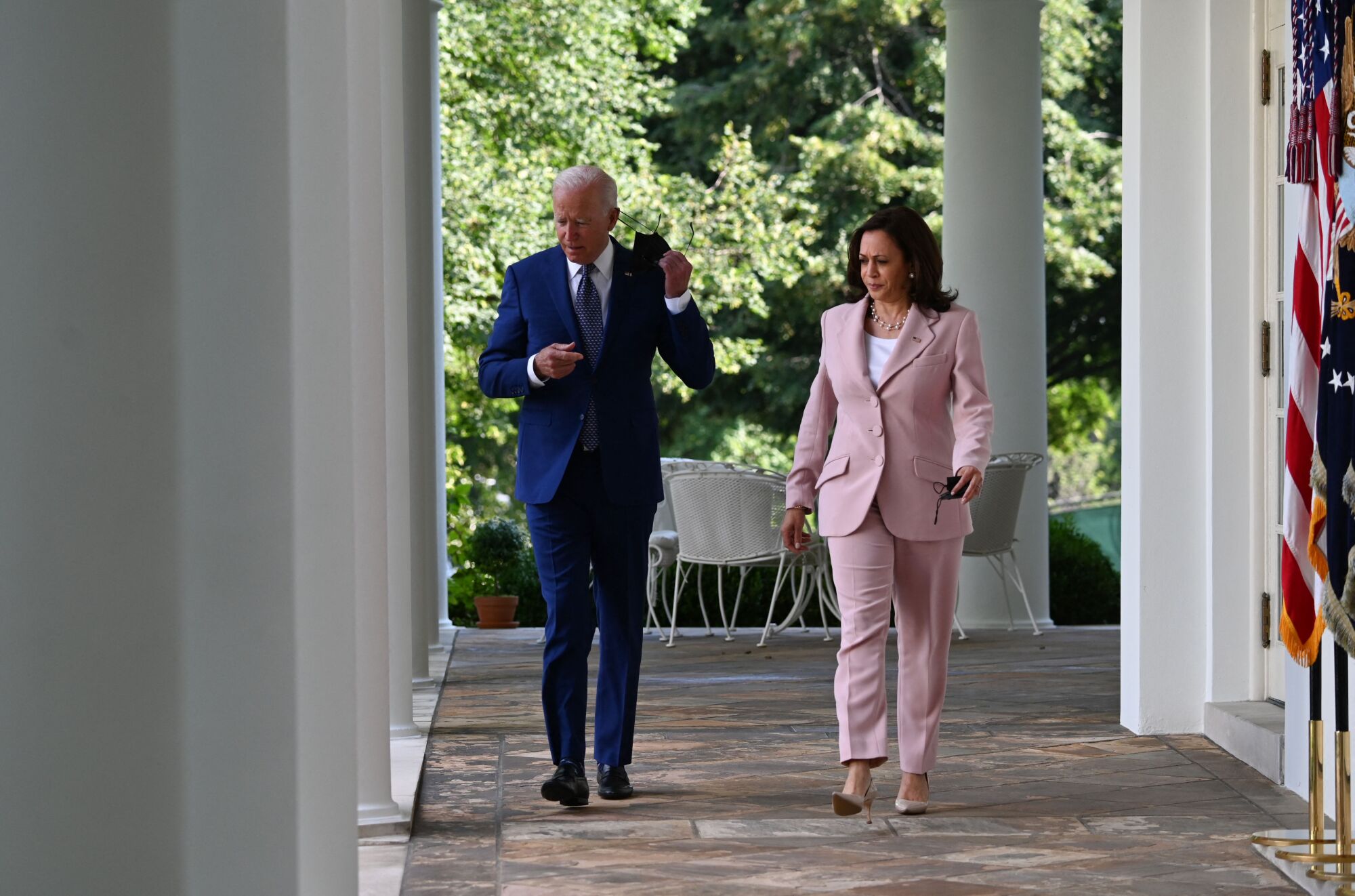 President Biden and Vice President Kamala Harris arrive at the White House Rose Garden.