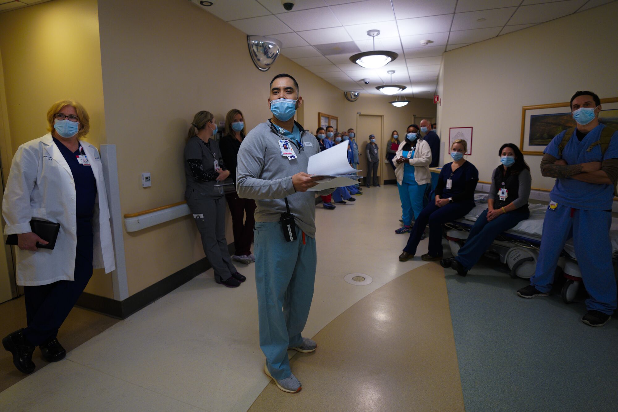 Nurses gather for the shift change huddle in the emergency room of Sharp Grossmont Hospital in 2020.
