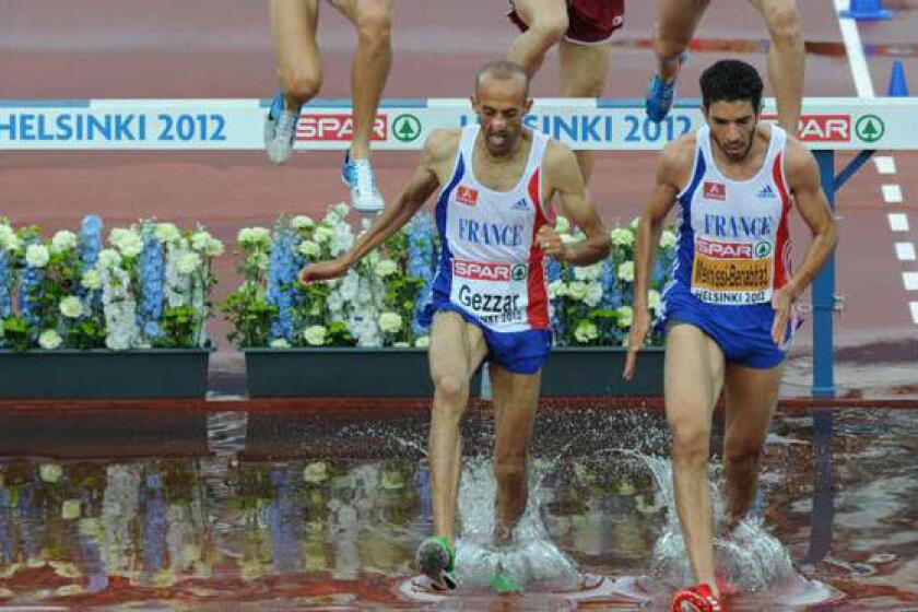 France's Nordine Gezzar, left, competes during the 2012 European Athletics Championships on June 27.