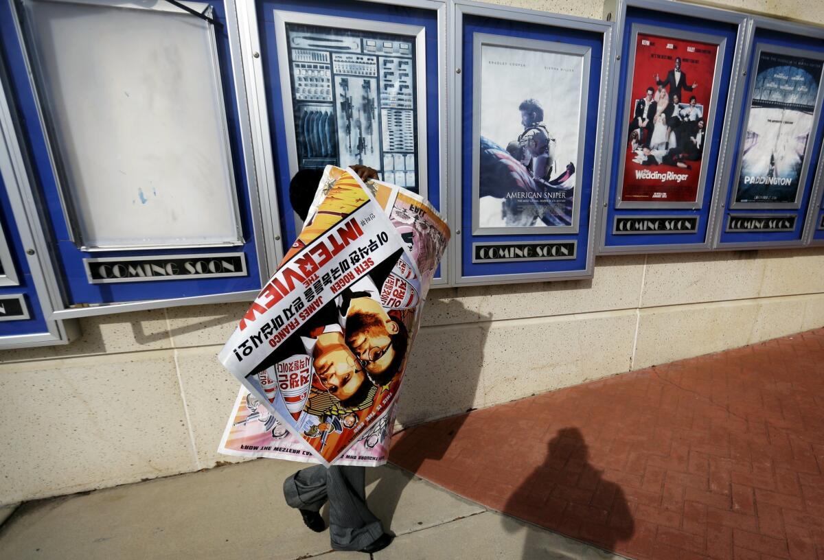 Posters for "The Interview" were taken down last week, but will start appearing again in independent theaters that received the green light from Sony Tuesday morning to screen the film on Christmas Day.