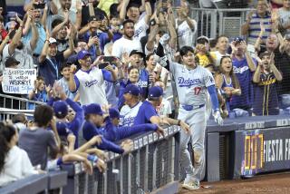 Los Angeles Dodgers Japanese Shohei Ohtani is celebrated after hitting a two-run home run during the 7th inning of a baseball game against the Miami Marlins at Loan Depot park in Miami, Florida on September 19, 2024. Ohtani became the first player to hit 50 or more homers and steal 50 or more bases in a single season in MLB, Major League Baseball, history.( The Yomiuri Shimbun via AP Images )