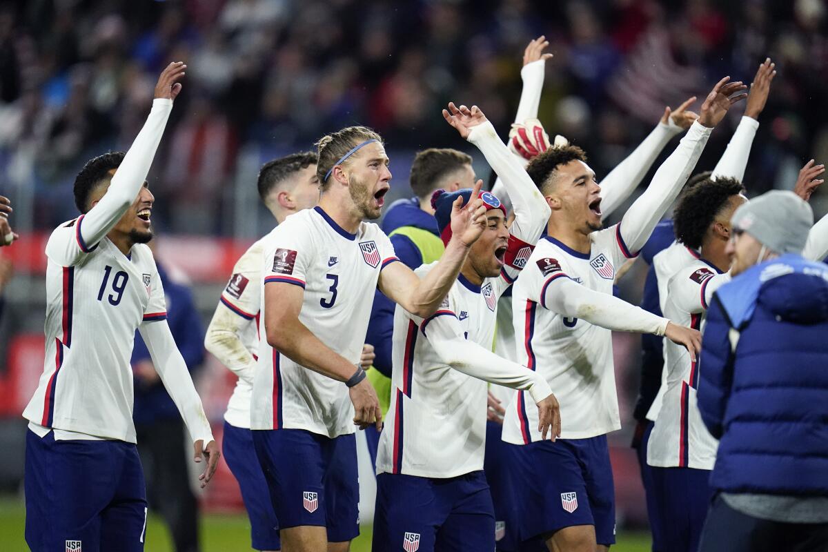 U.S. players react after defeating Mexico 2-0 in World Cup qualifying on Friday.