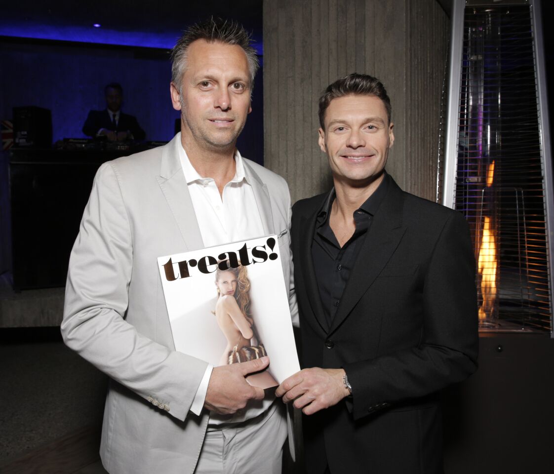 Treats! publisher Steve Shaw, left, and Ryan Seacrest pose with the latest issue, with Dylan Penn on the cover.
