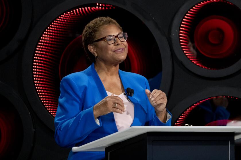 Los Angeles, CA - October 06: Los Angeles Mayoral candidate builder Rick Caruso, not pictured, listens to Congresswoman Karen Bass speak as they participate in the second one-on-one mayoral debate at the KNX Newsradio SoundSpace Stage in Los Angeles, Thursday, Oct. 6, 2022. (Allen J. Schaben / Los Angeles Times)