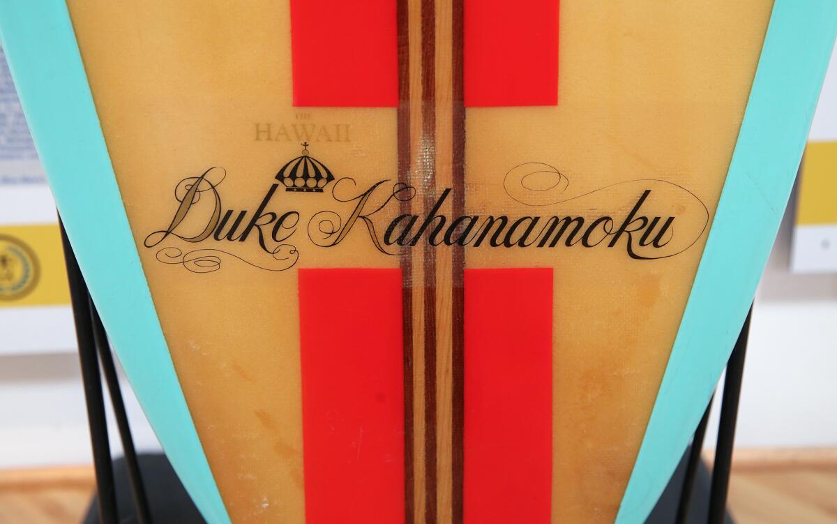 A vintage surfboard with stylish graphics in honor of Duke Kahanamoku.