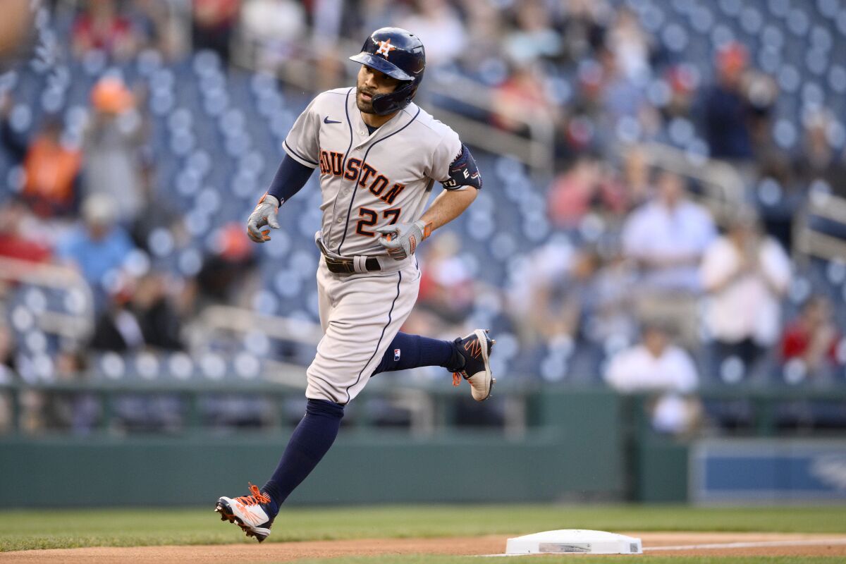 Houston Astros' Jose Altuve rounds third on his home run during the first inning of a baseball game against the Washington Nationals, Friday, May 13, 2022, in Washington. (AP Photo/Nick Wass)
