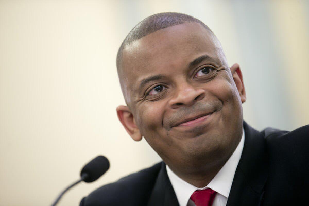 Anthony Foxx, mayor of Charlotte, N.C., smiles during a Senate Transportation Committee hearing in Washington.