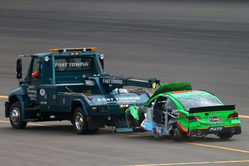 Danica Patrick's No. 10 GoDaddy.com Chevrolet is towed off the track after a wreck during the NASCAR Sprint Cup Series race Sunday at Phoenix International Raceway.