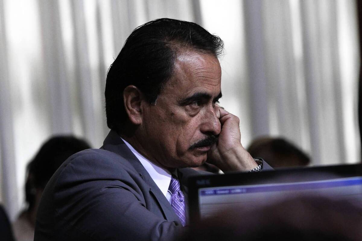 Richard Alarcon listens at a Los Angeles City Council meeting in 2011. A cousin and staff member testified at Alarcon's perjury and fraud trial that the veteran politician moved into his Panorama City home within 30 days of his election to the state Assembly in November 2006.
