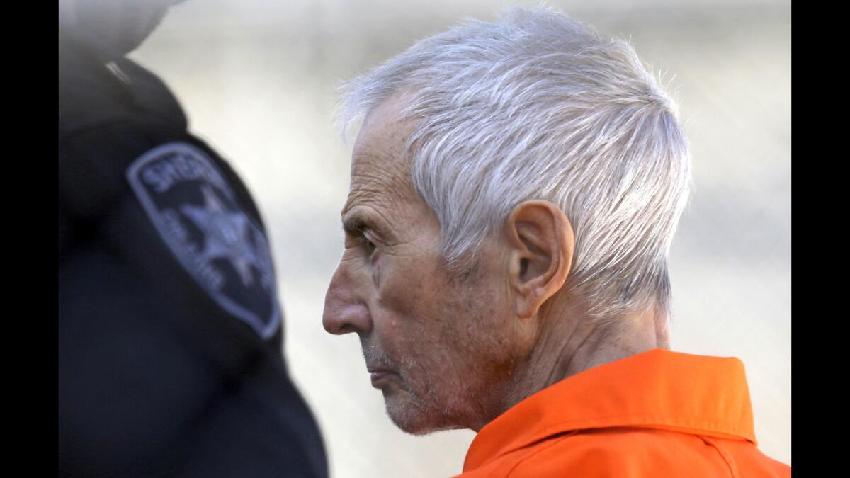 Robert Durst is escorted into prison after his arraignment in New Orleans in 2017.