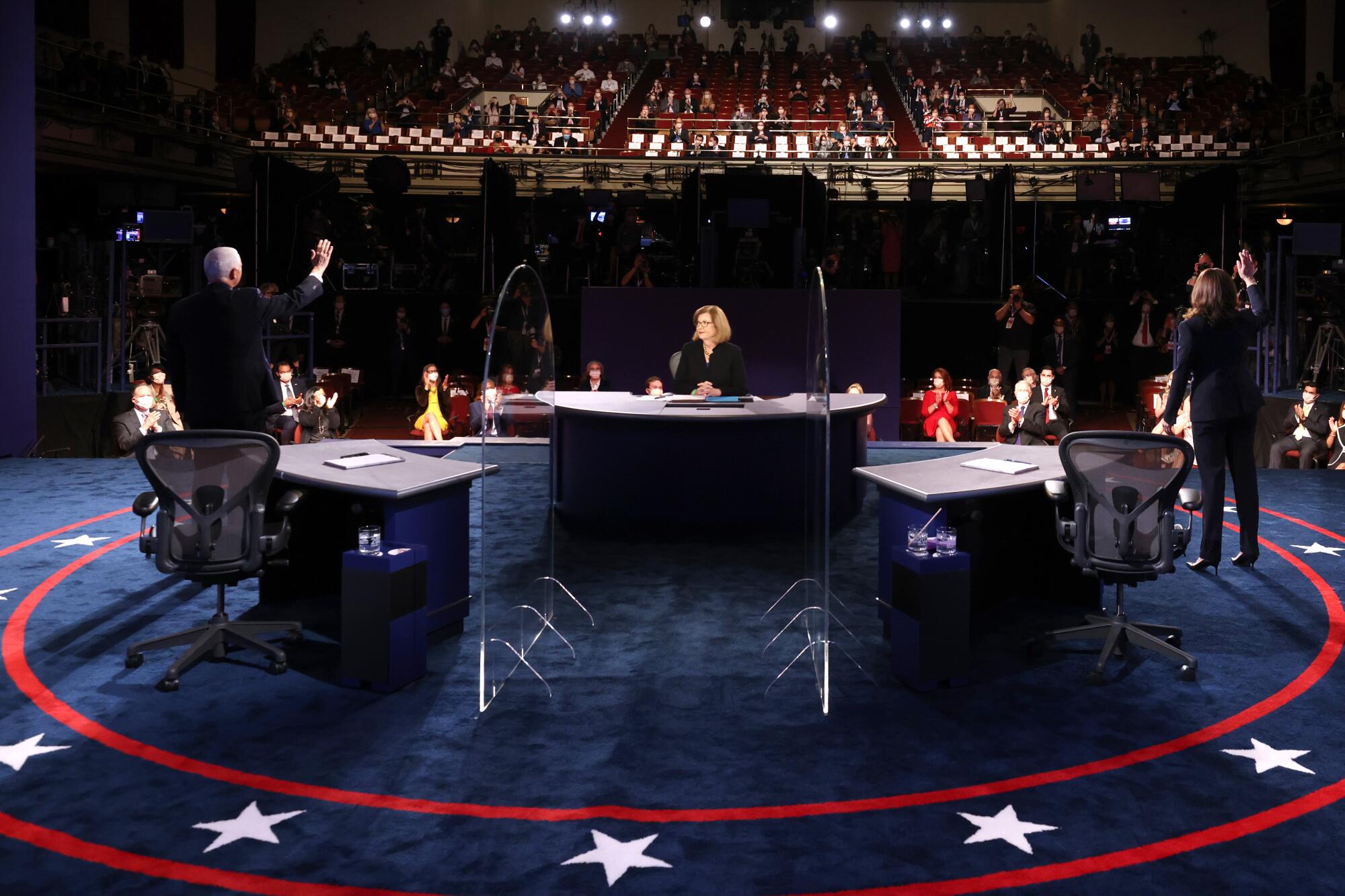 Mike Pence, Kamala Harris and Susan Page at the vice presidential debate in Salt Lake City. 